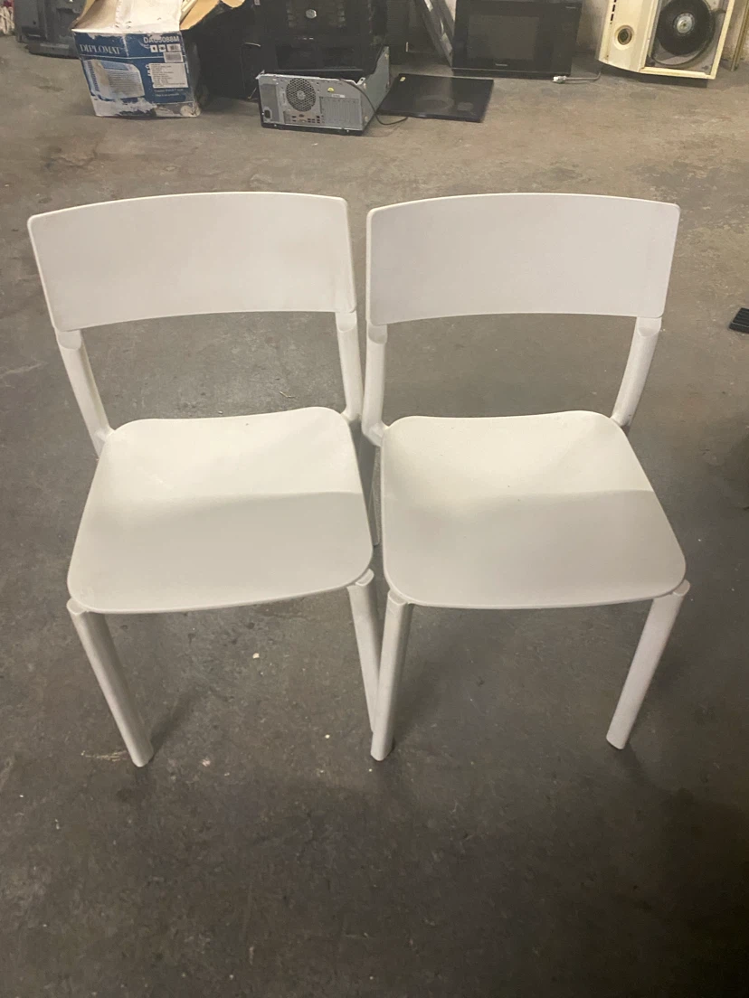 Two white dining chairs