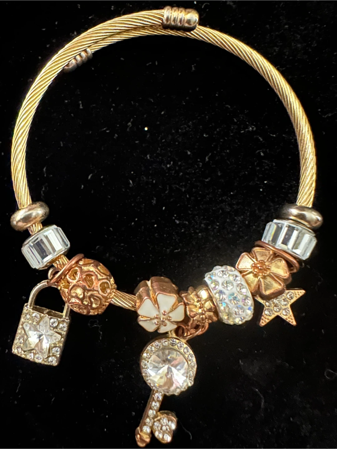 Gold Tone Charm Bracelet with Decorative Charms