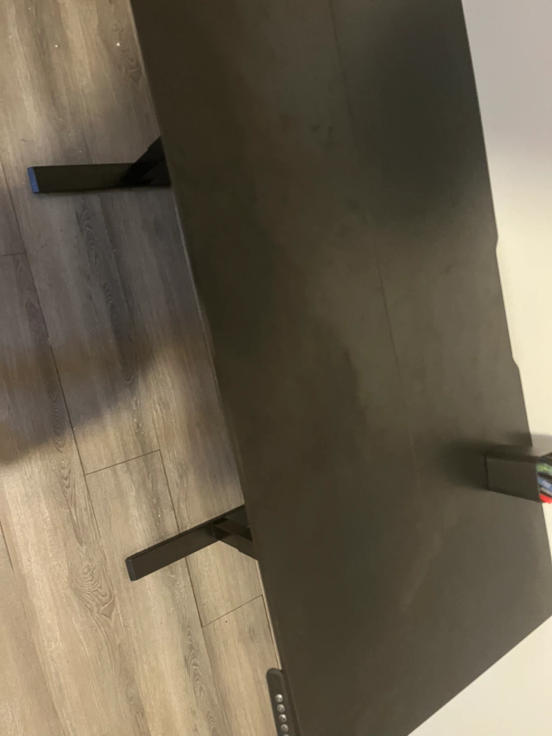 Black adjustable standing desk and office chair