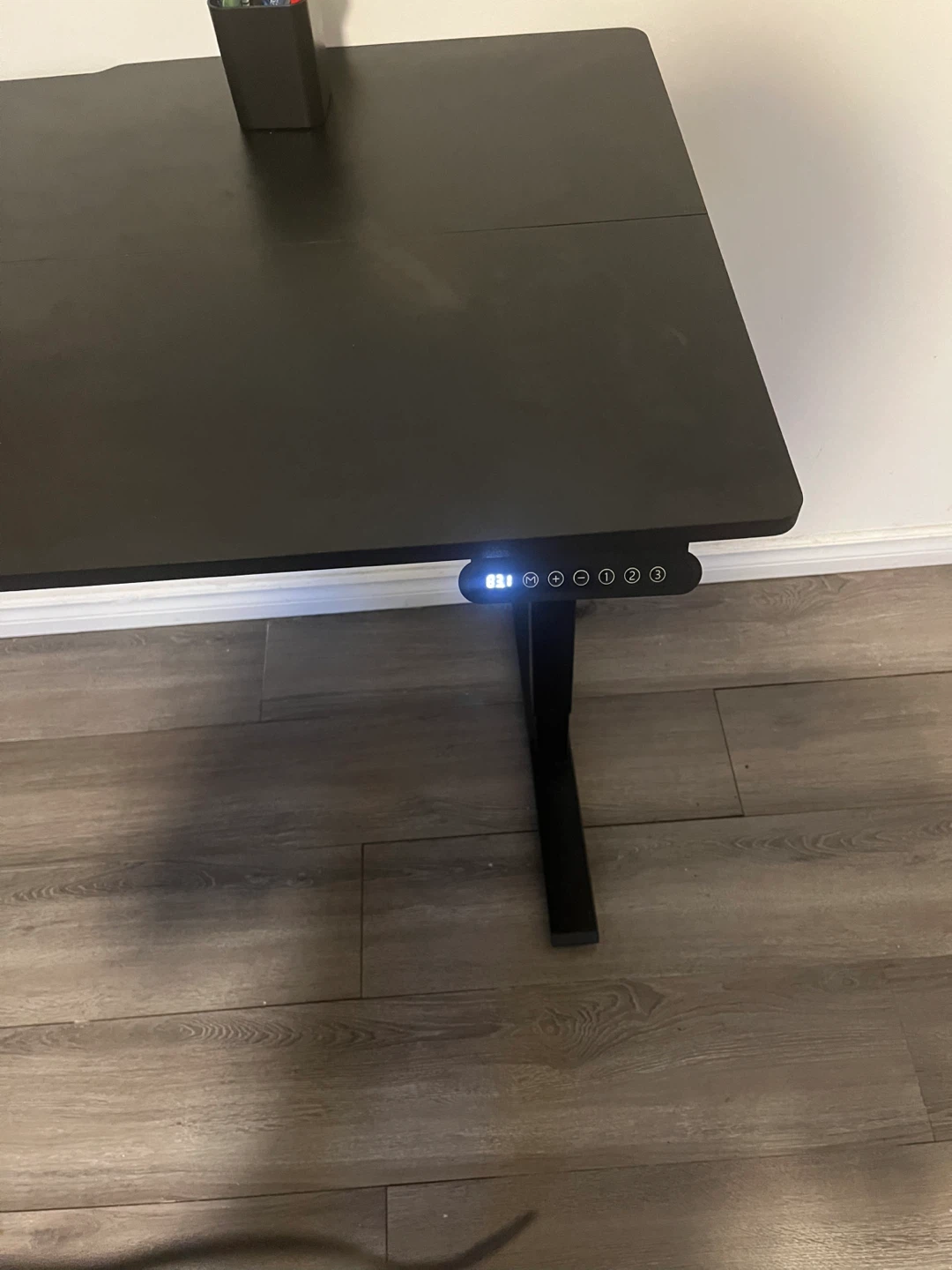 Black adjustable standing desk and office chair - photo 2