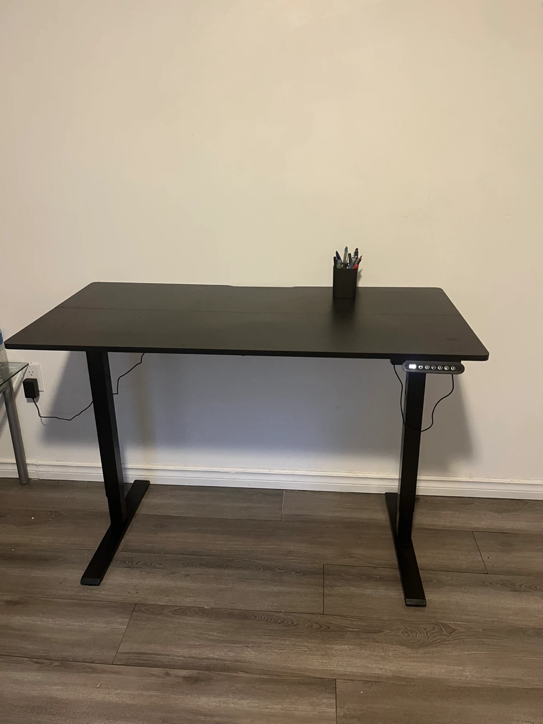 Black adjustable standing desk and office chair - photo 3