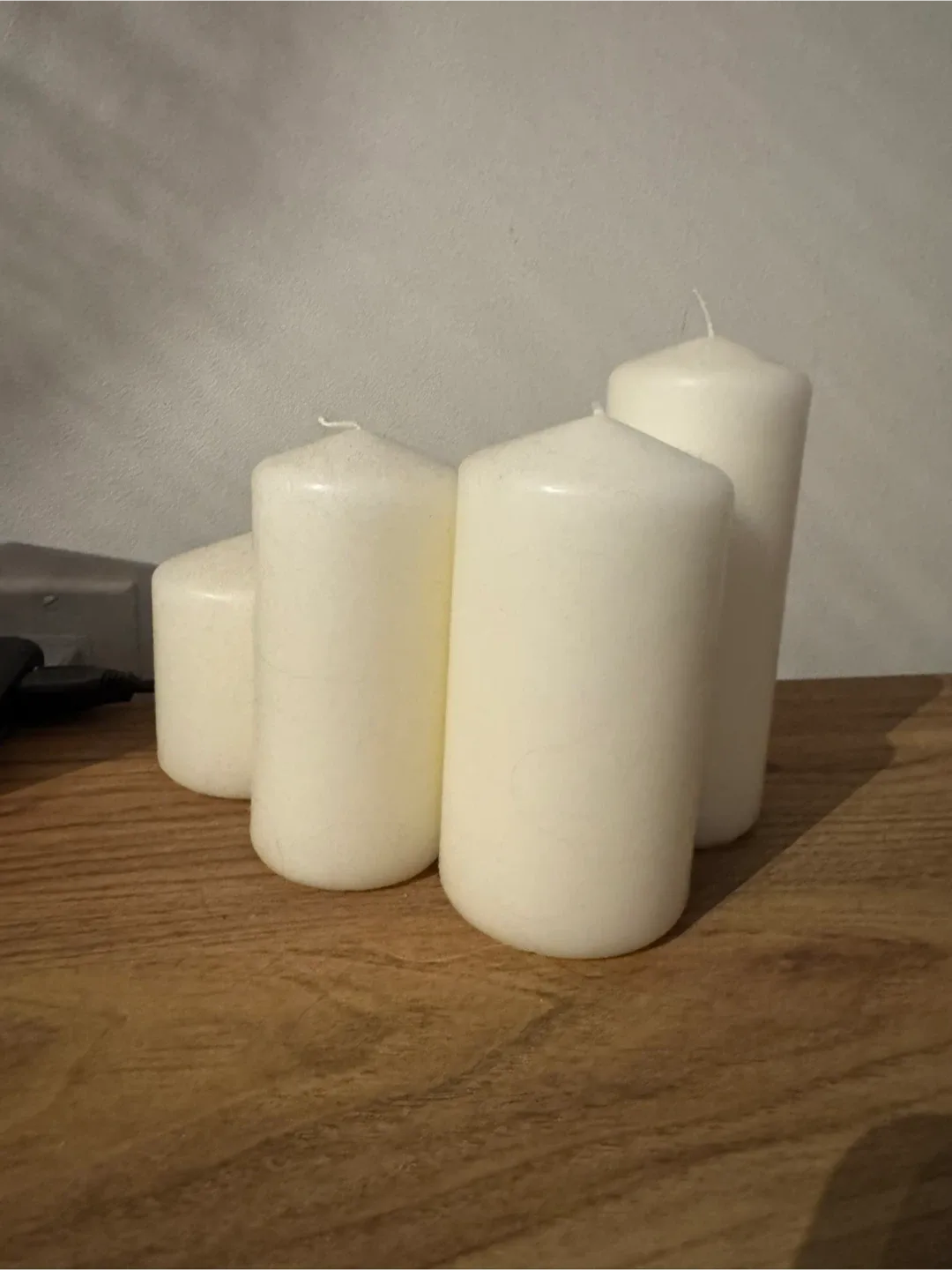 Set of four off-white pillar candles