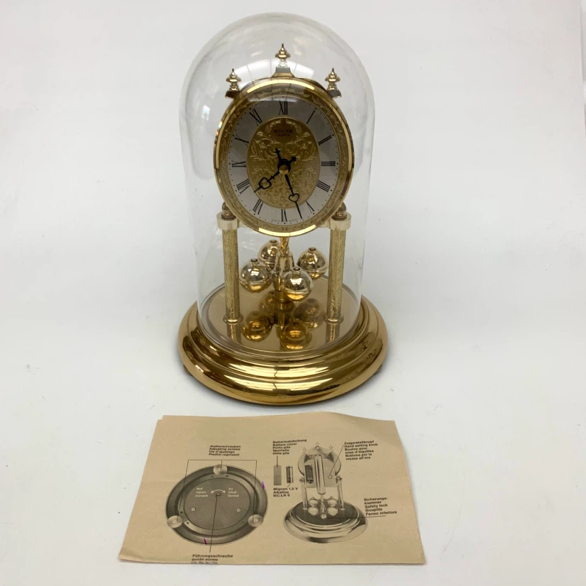 Solar Quartz Anniversary Clock Gold Rotating Pendulum Glass Dome