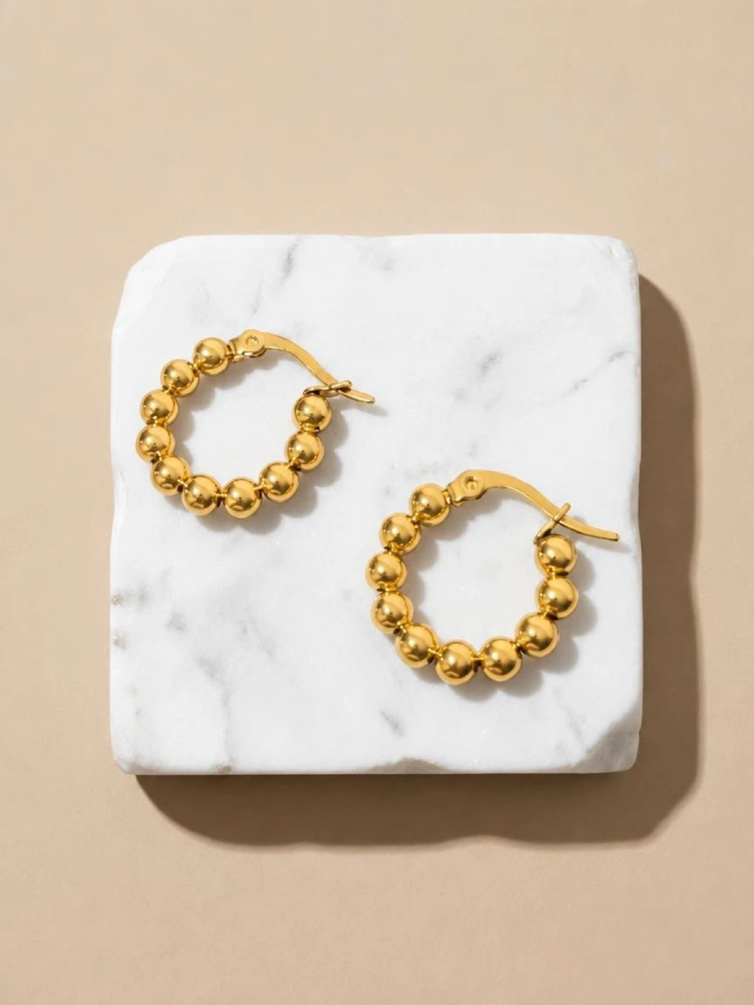 Gold-toned beaded hoop earrings