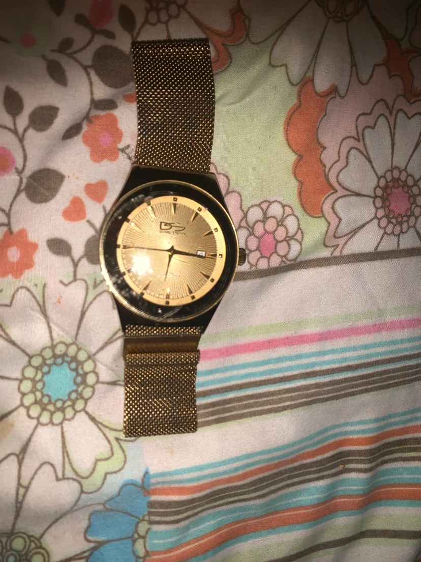 Gold tone Daniel Steiger watch