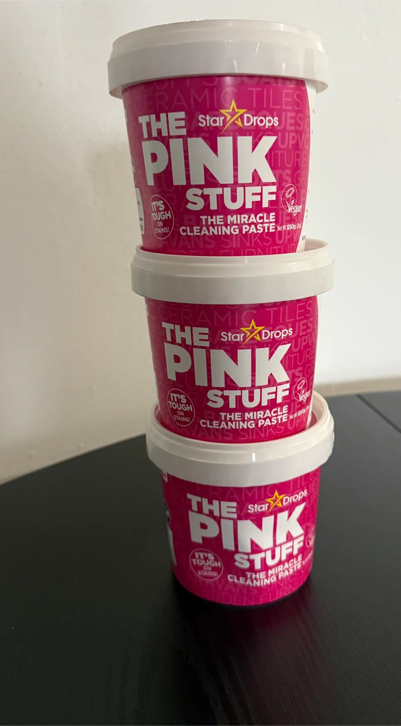 Three tubs of The Pink Stuff cleaning paste