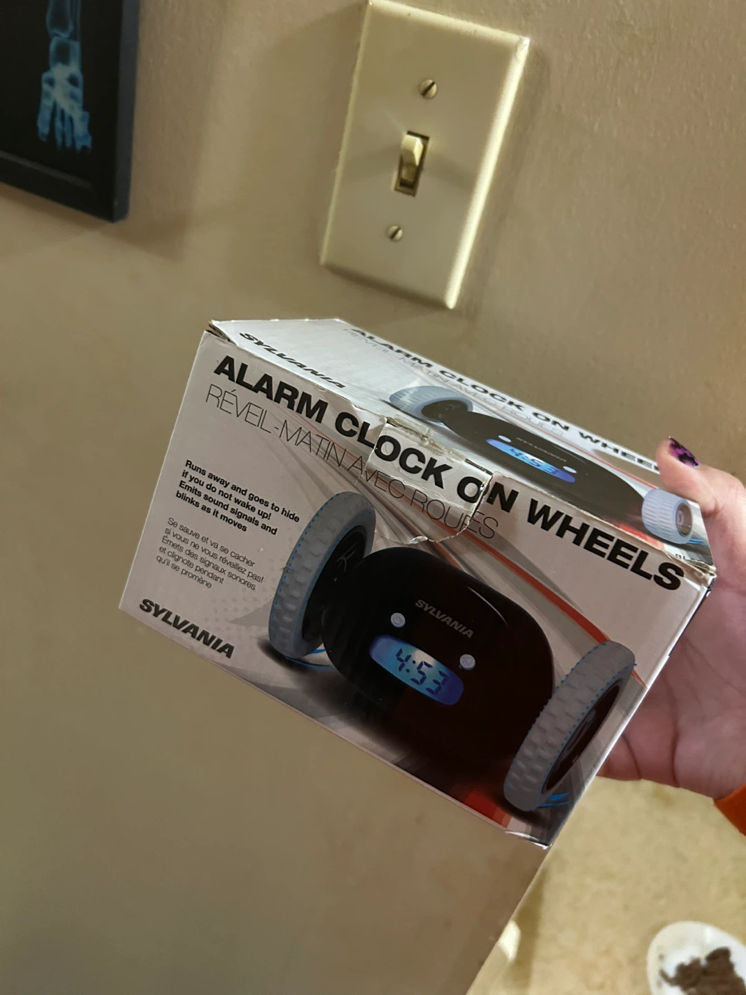 Sylvania Alarm Clock on Wheels