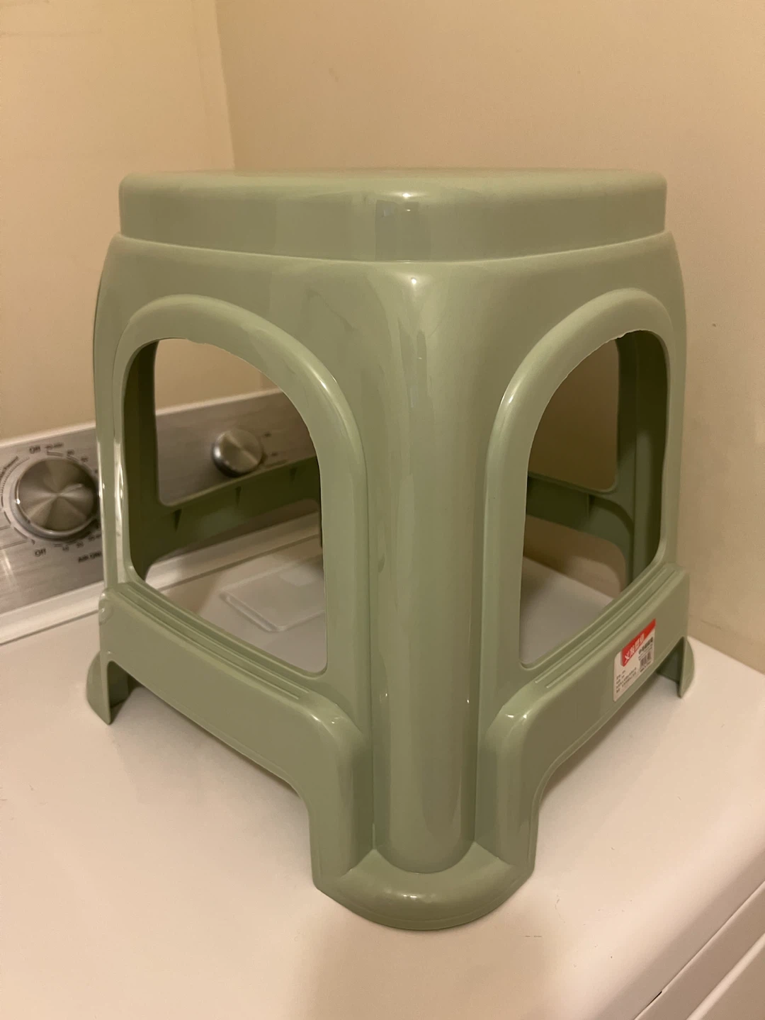Green plastic square step stool