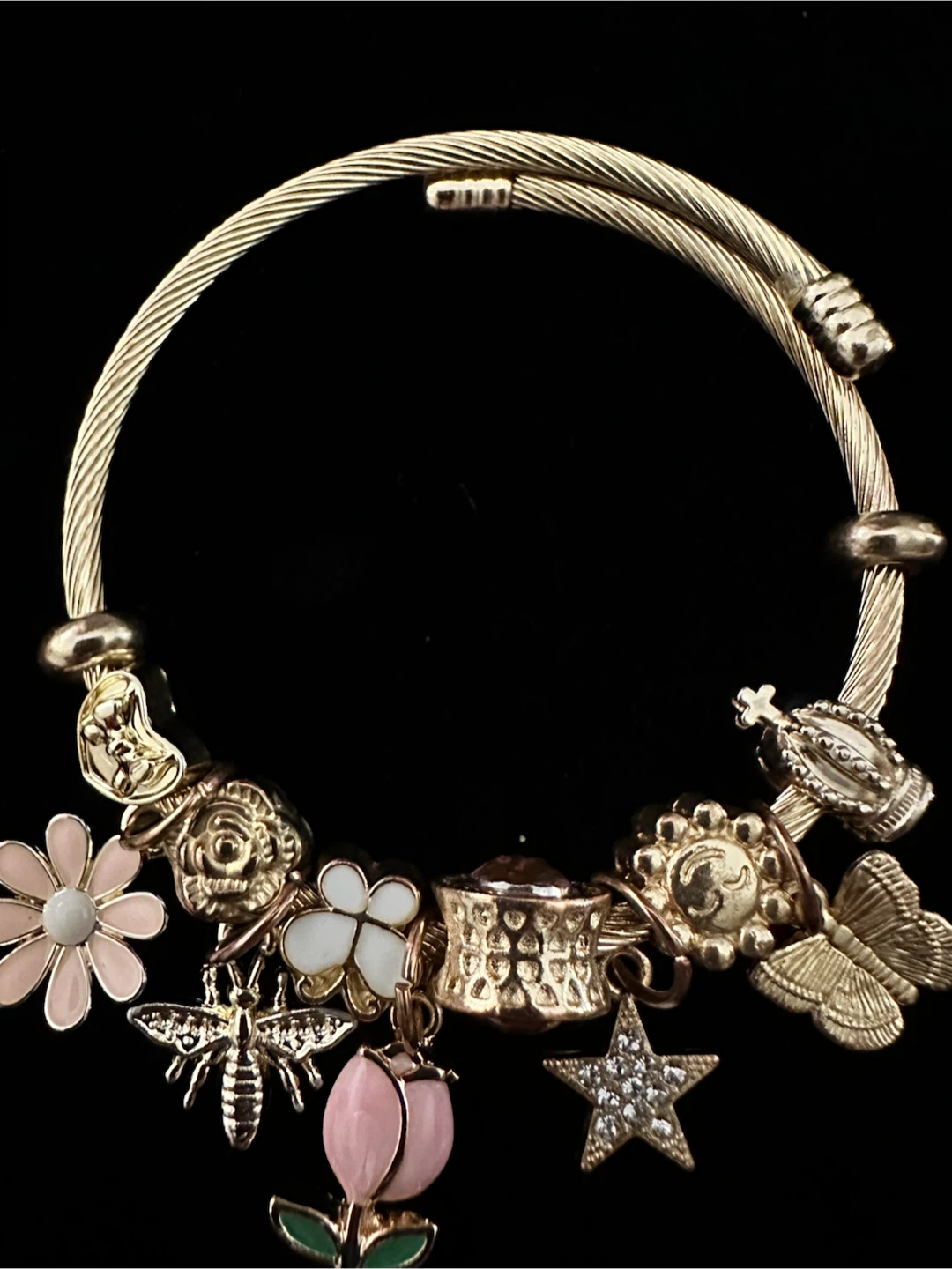Gold-tone charm bracelet with assorted charms