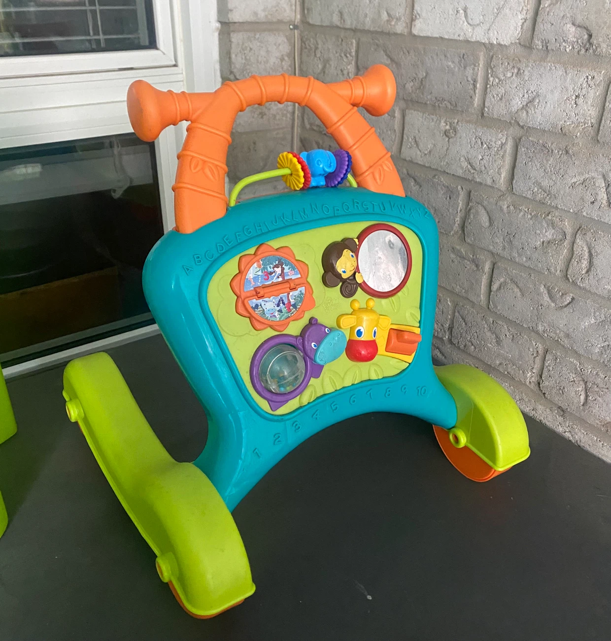 Baby walker with activity board