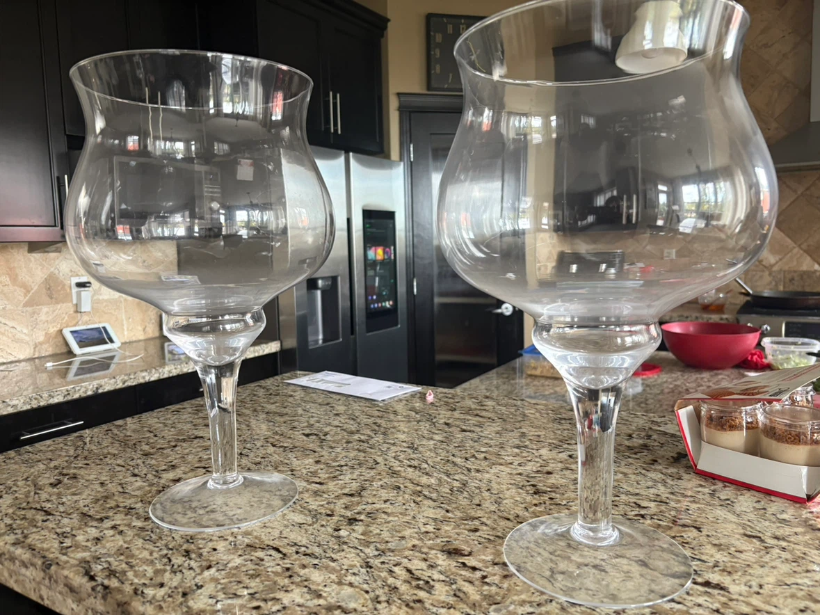 Two large glass hurricane candle holders