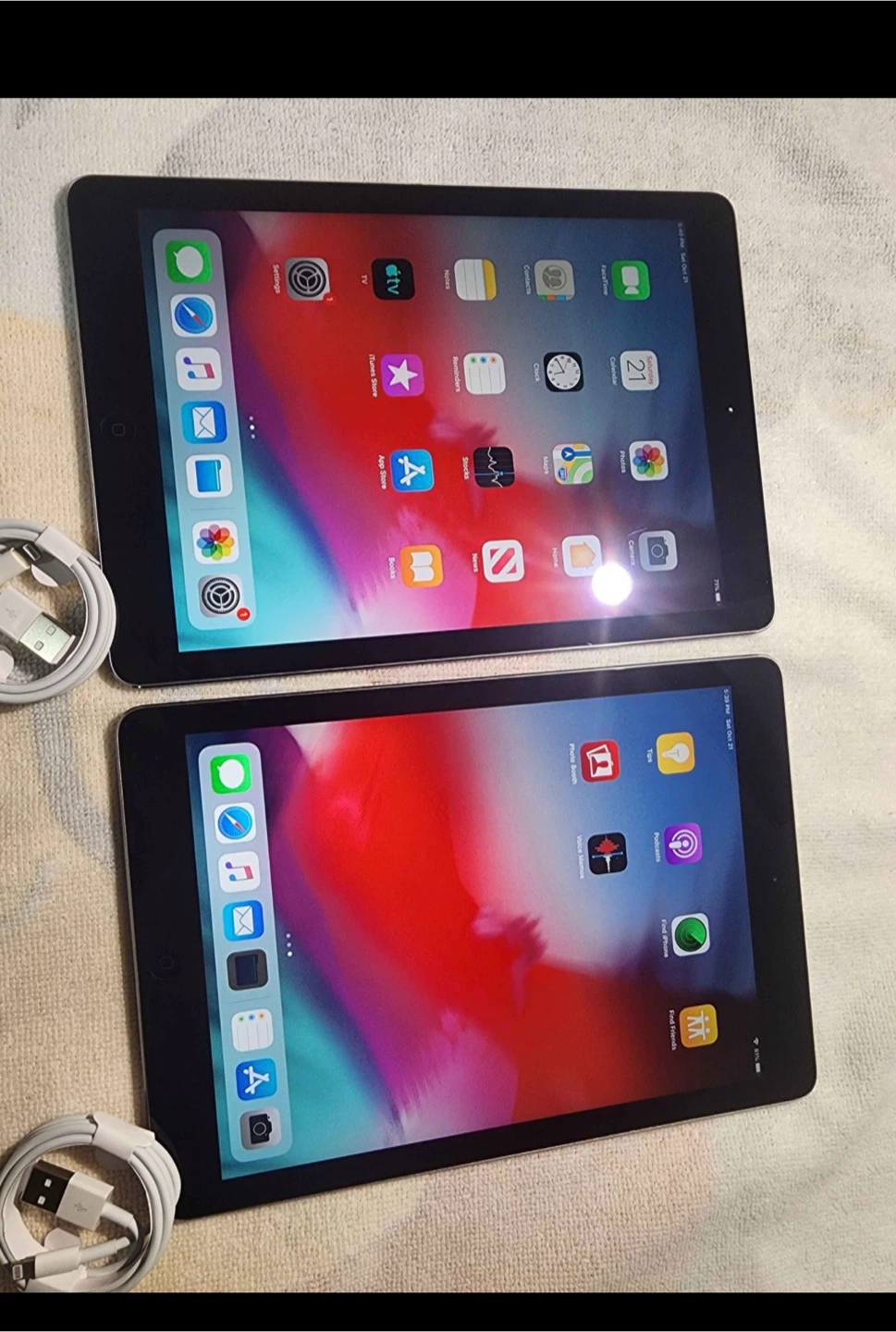 Two Apple iPads with Charging Cables