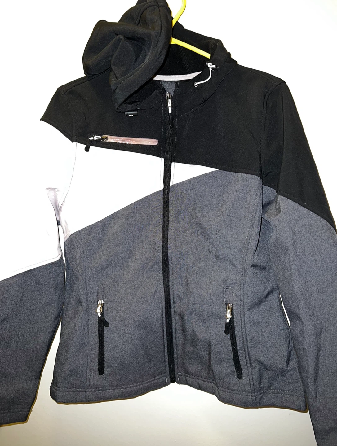 Black, grey, and white softshell jacket