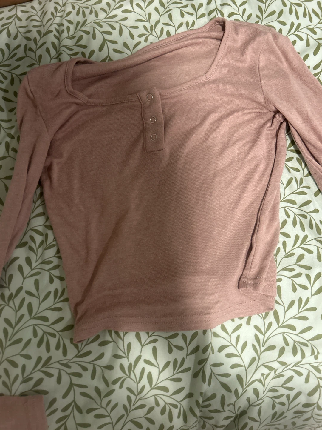 Pink long sleeve button-up crop top