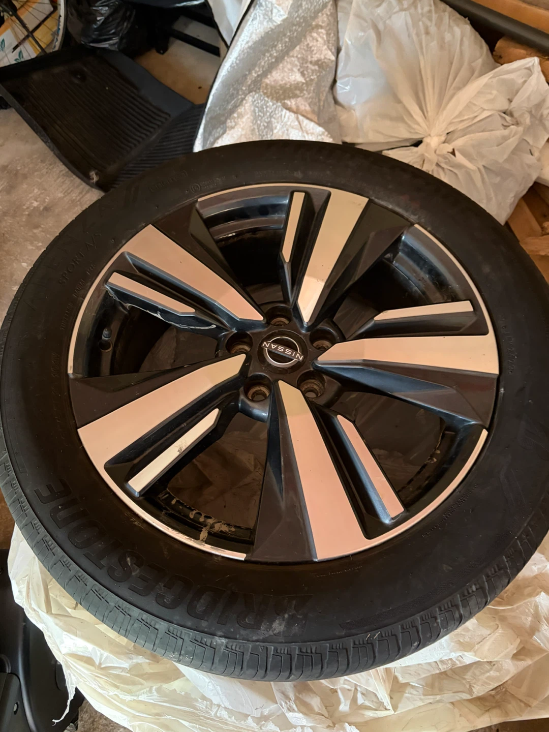 Nissan Rogue alloy rim with Bridgestone tire