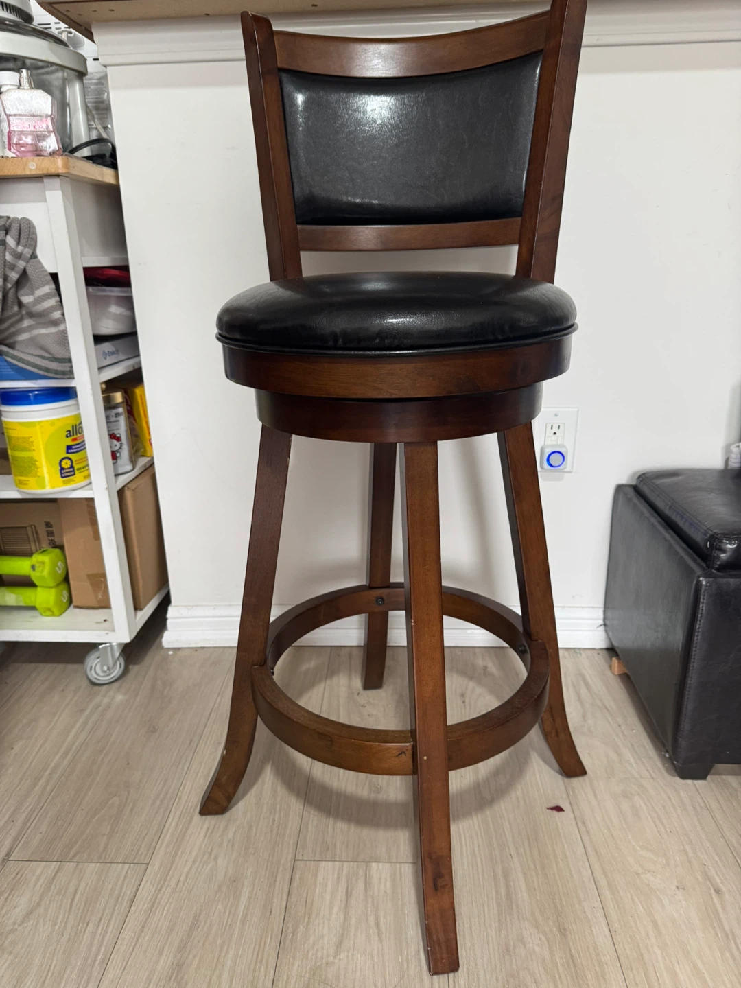 Swivel bar stool with wood frame and black seat