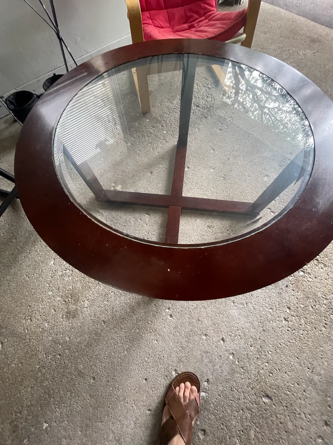 Round wooden coffee table with glass top