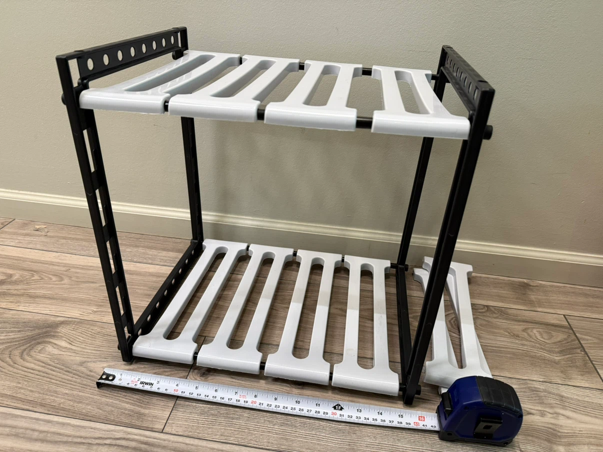 Adjustable under-sink shelf