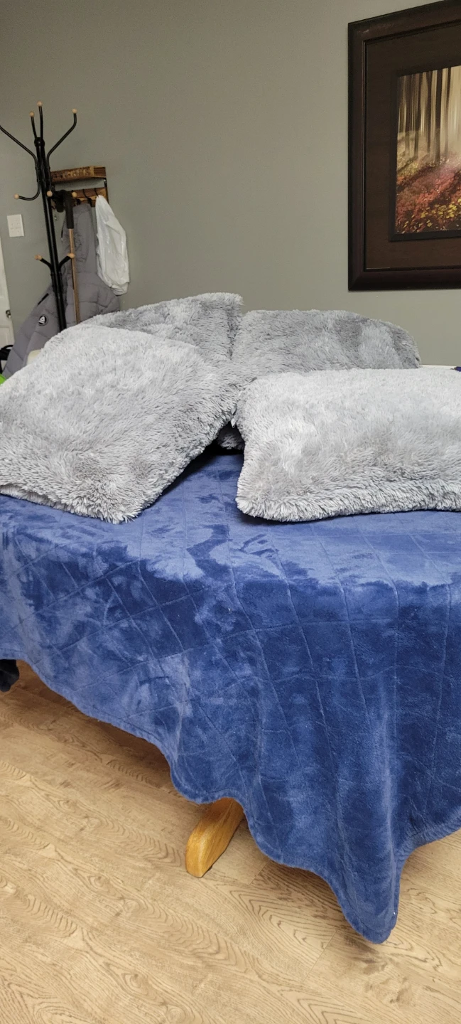 Set of four grey faux fur throw pillows