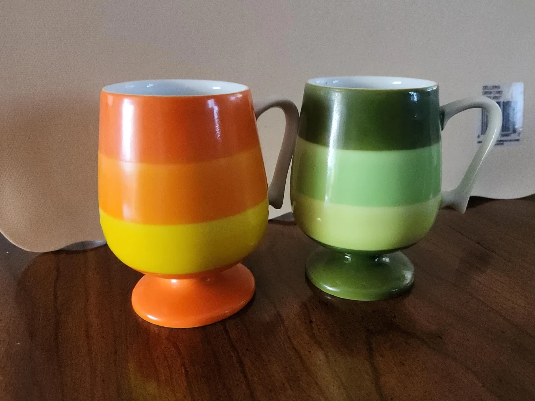 Two striped pedestal mugs