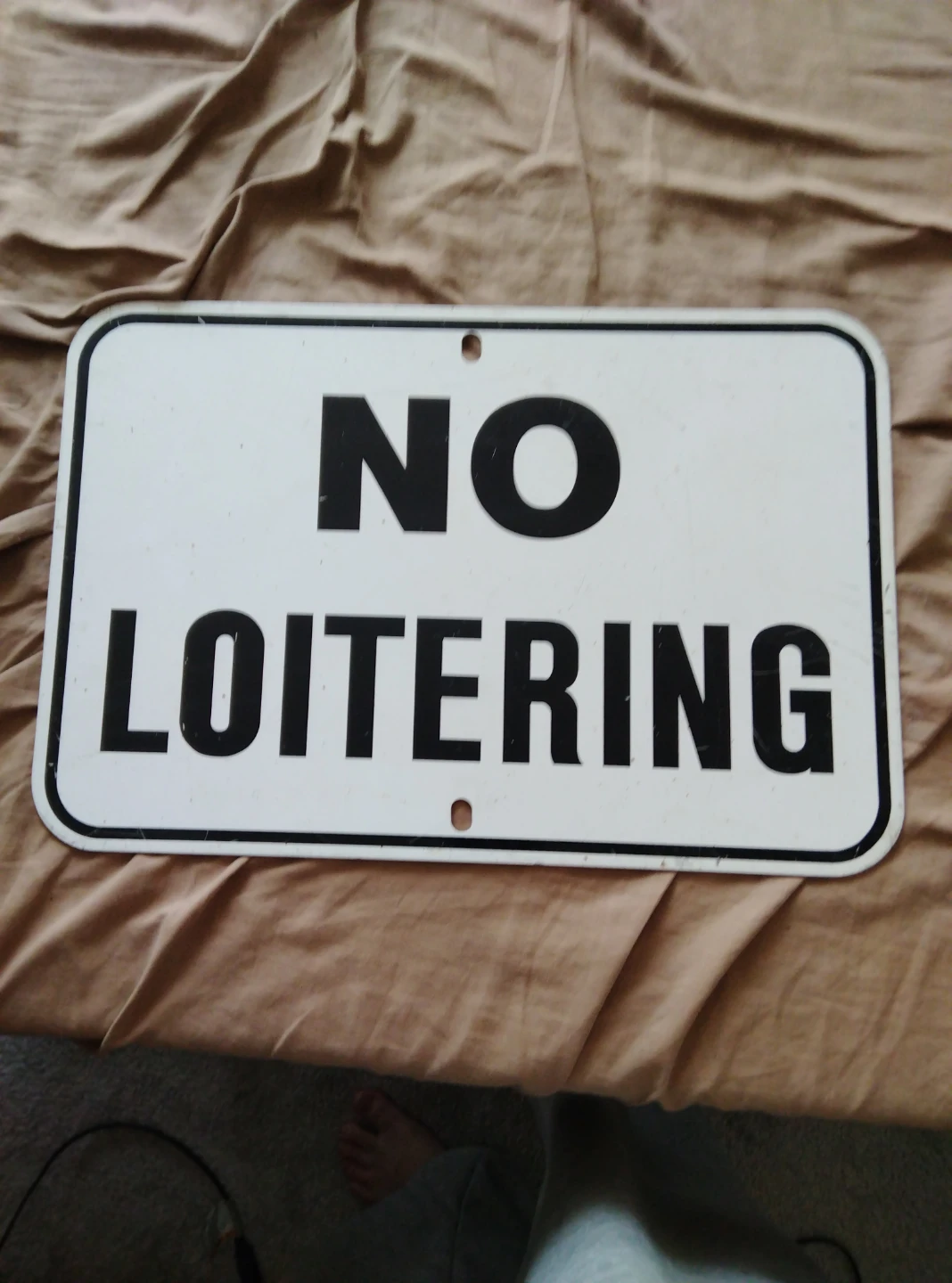 No Loitering Street Sign