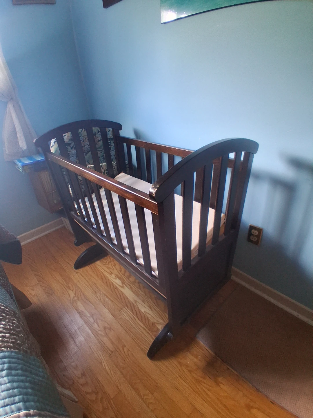Dark wood rocking cradle