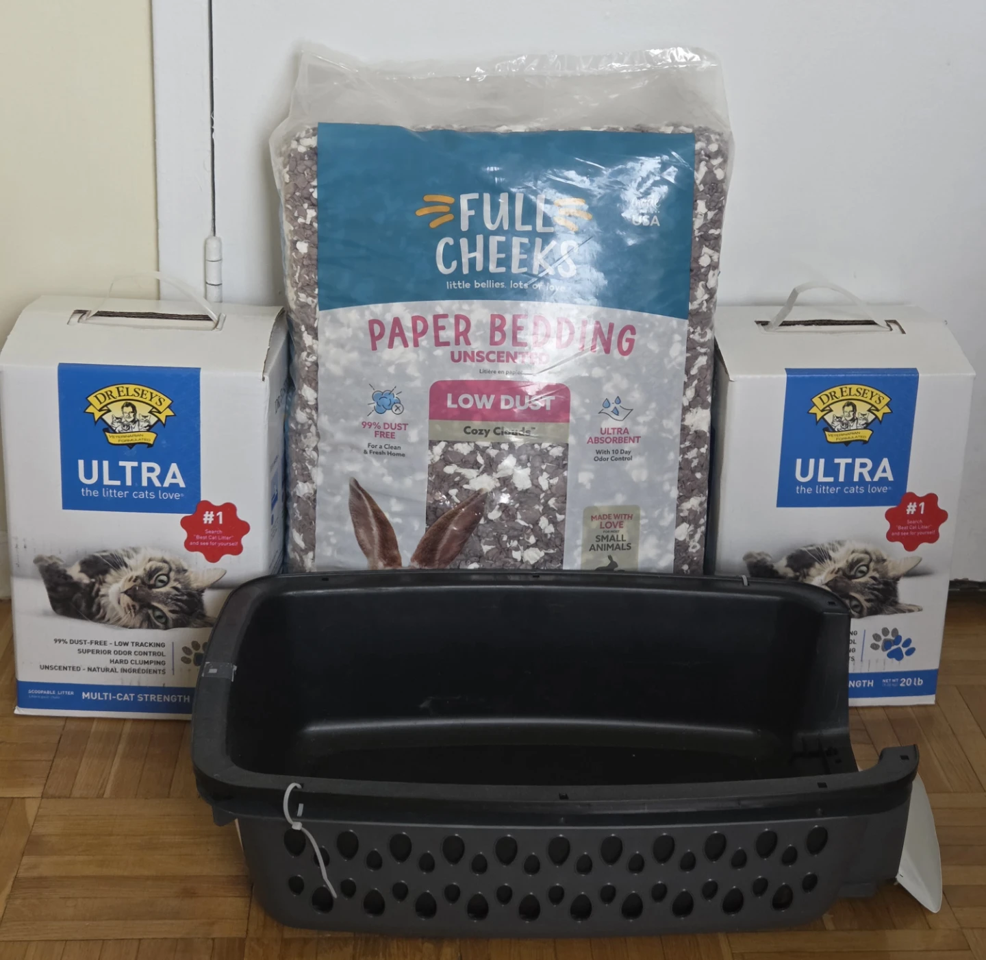 Cat supplies bundle including carrier, litter, and bedding
