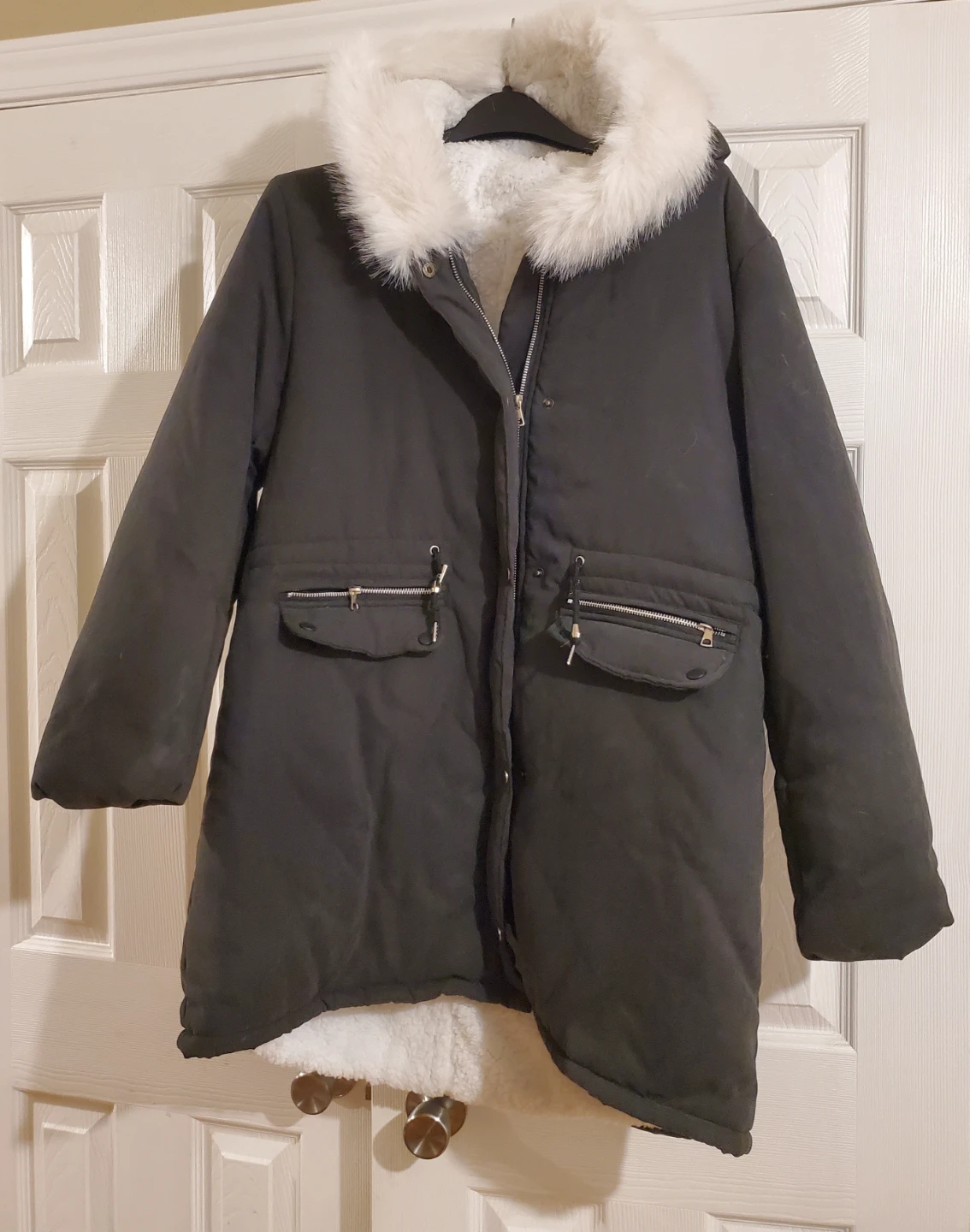 Black winter parka with faux fur trim