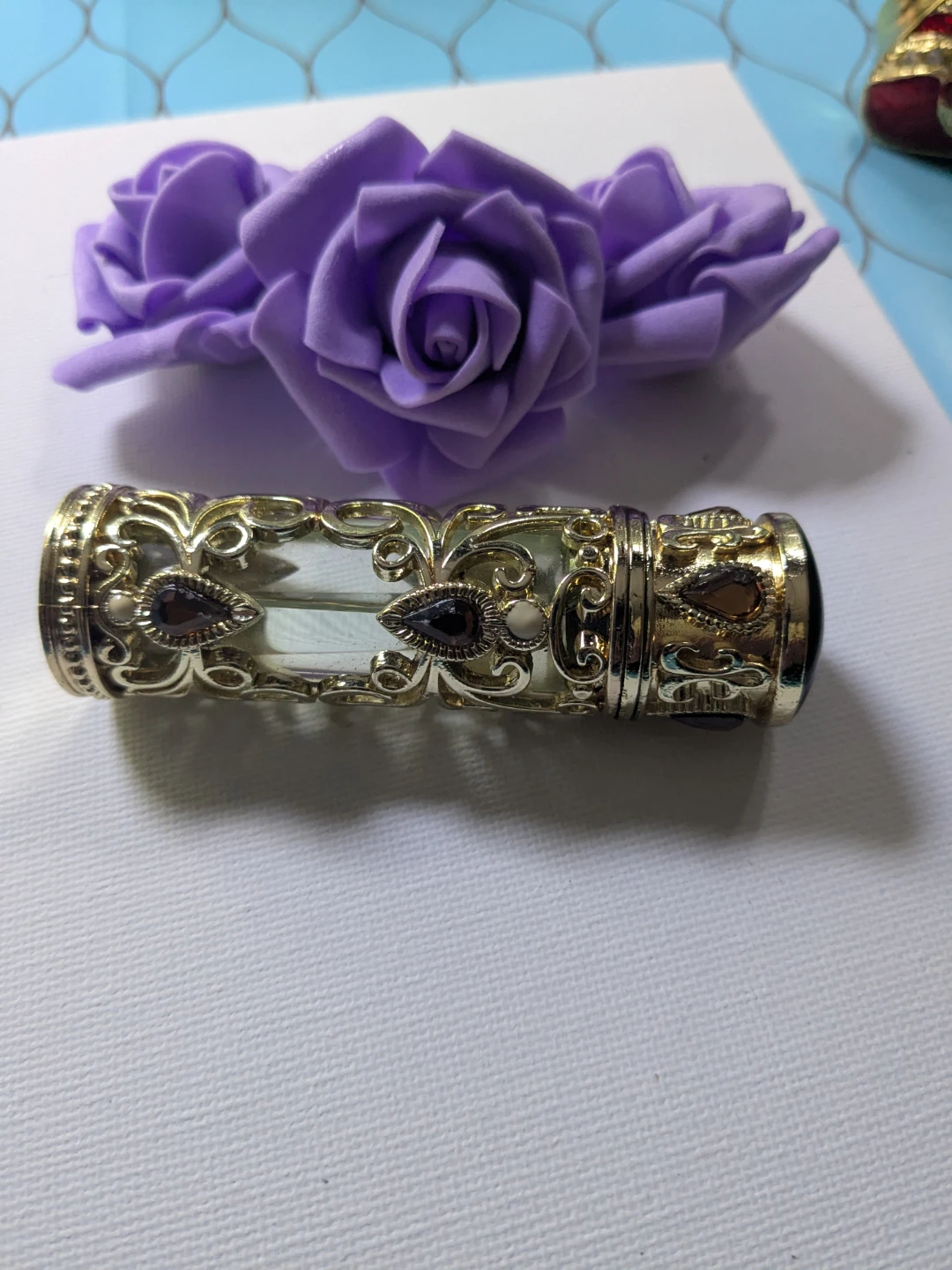 Gold and brown jewel oil dropper