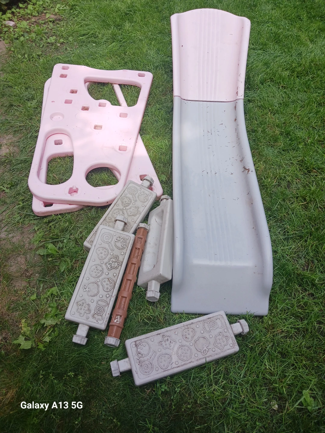Pink and grey kids slide and swing set