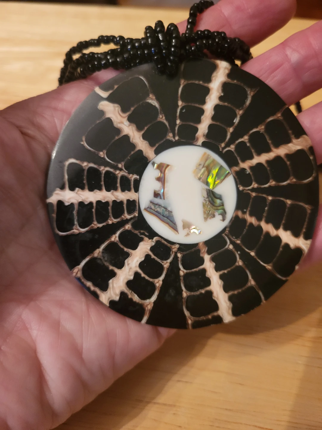 Large round patterned pendant necklace