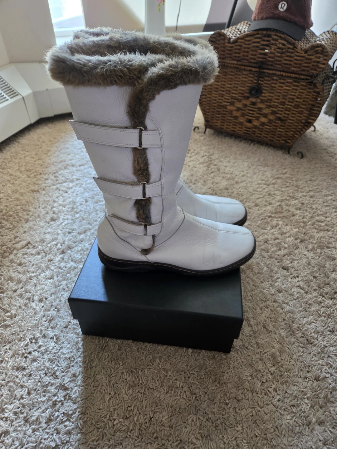 White winter leather boots with faux fur trim