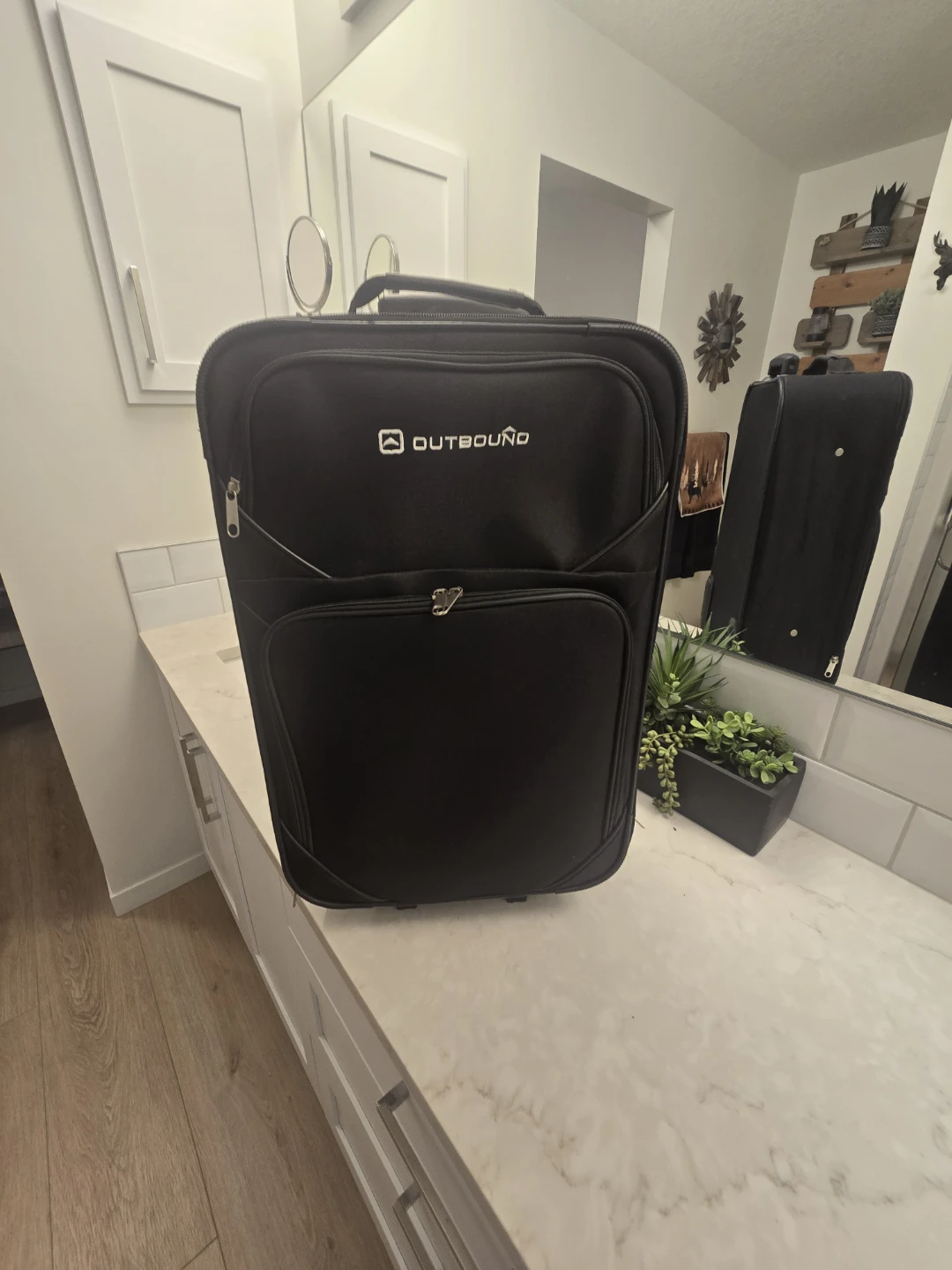 Outbound black rolling carry on suitcase