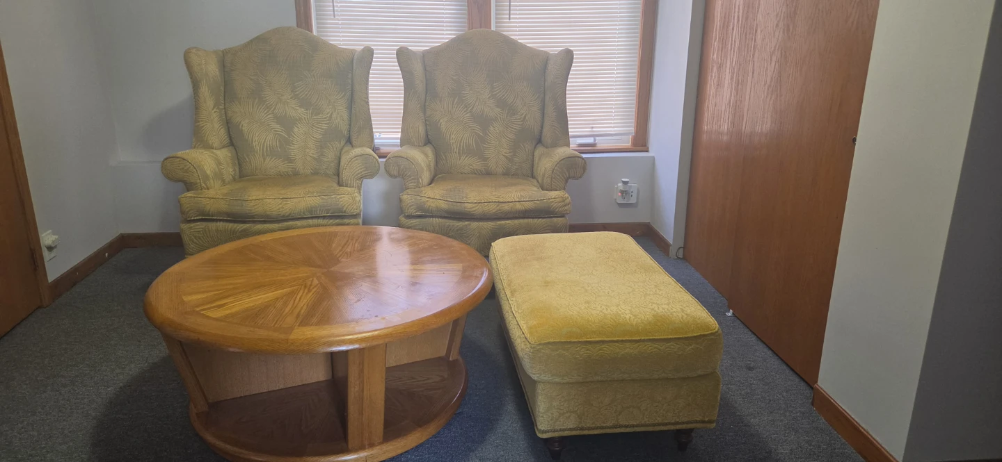 Two Vintage Wingback Chairs and Ottoman