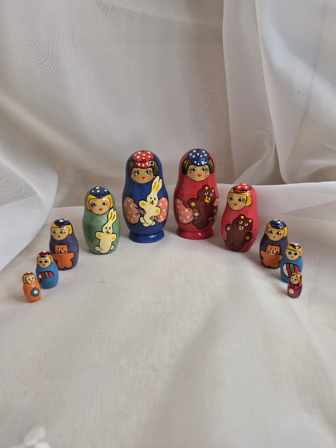 A Pair- 2 Set of 5 Wooden Russian Staking Dolls Sets