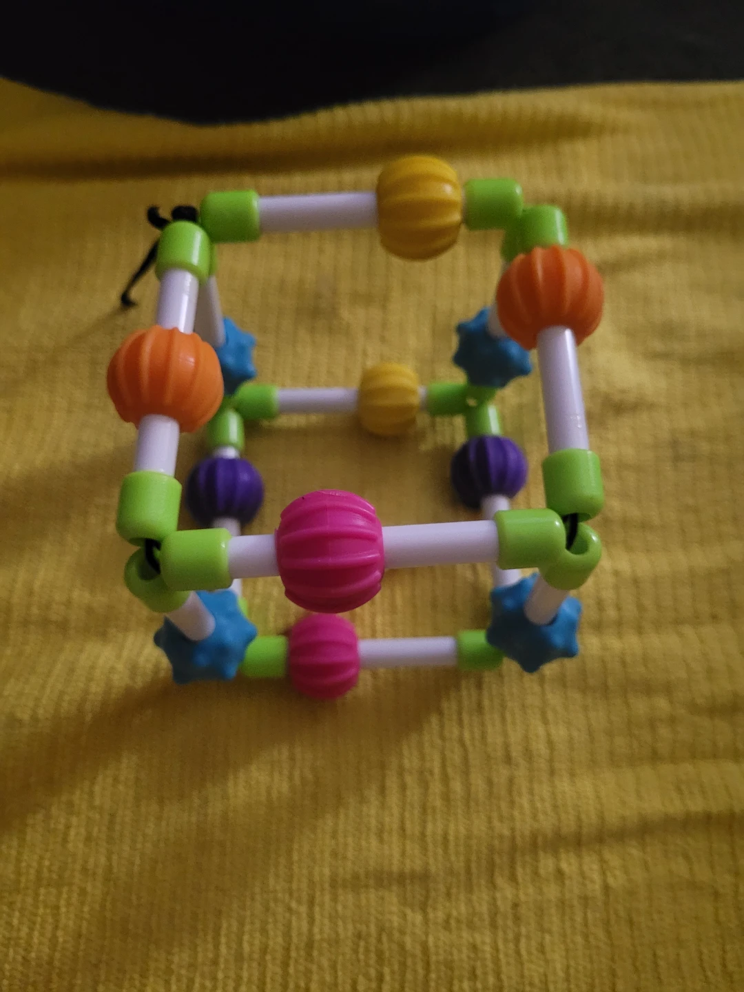 flexible sensory toy, the Fat Brain Toys Quubi.