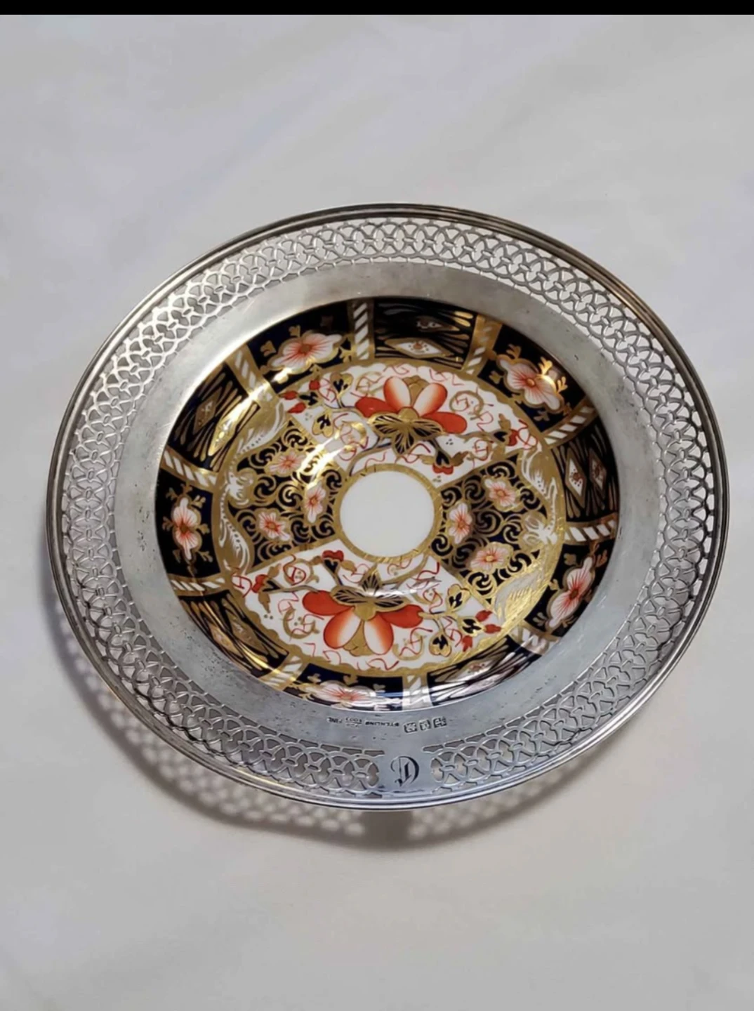 Royal Crown Derby plate with sterling silver rim