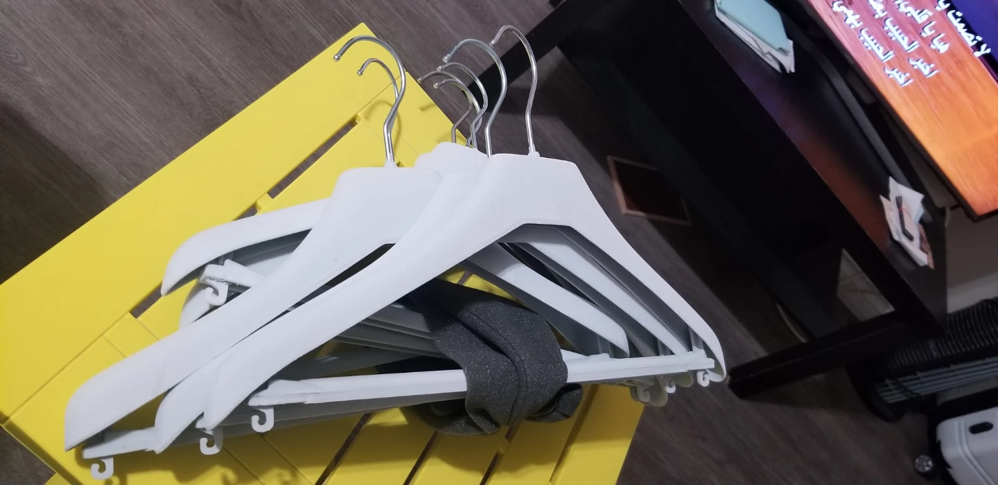 Set of 7 Light Gray plastic clothes hangers