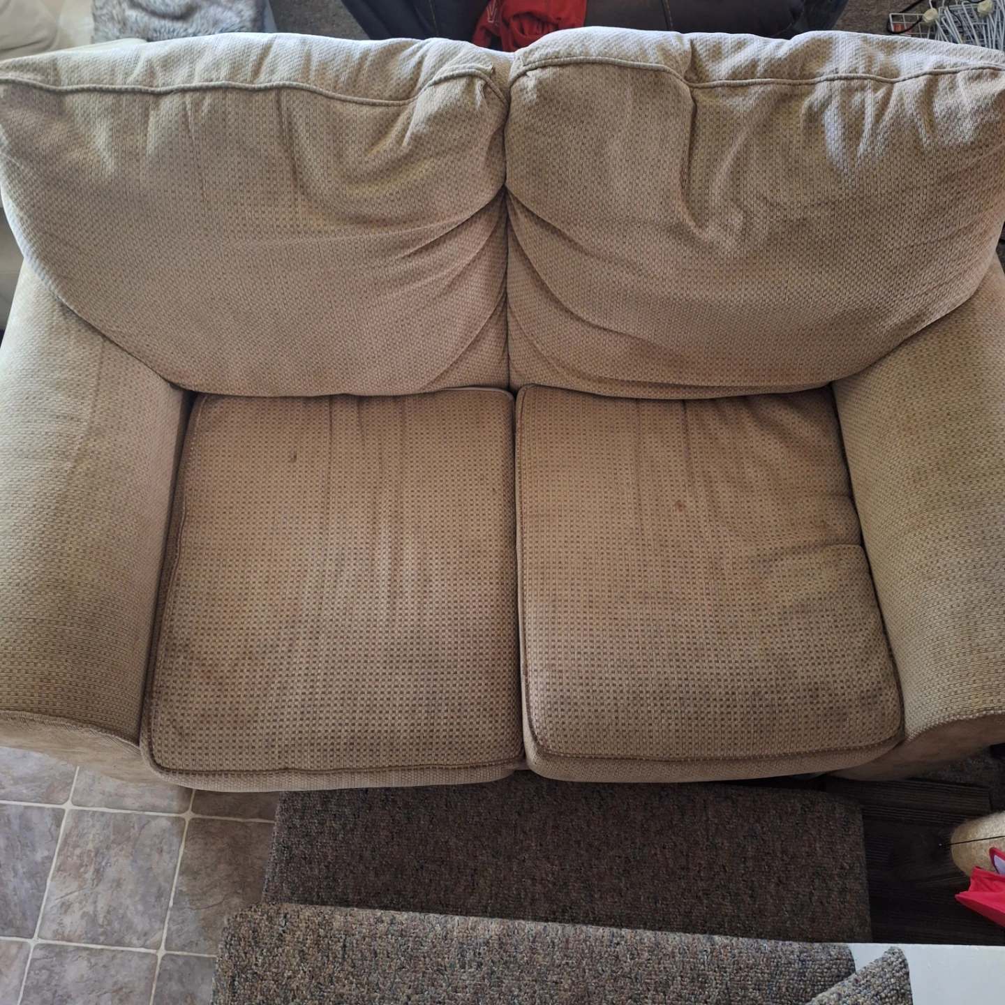 Beige two-seater sofa
