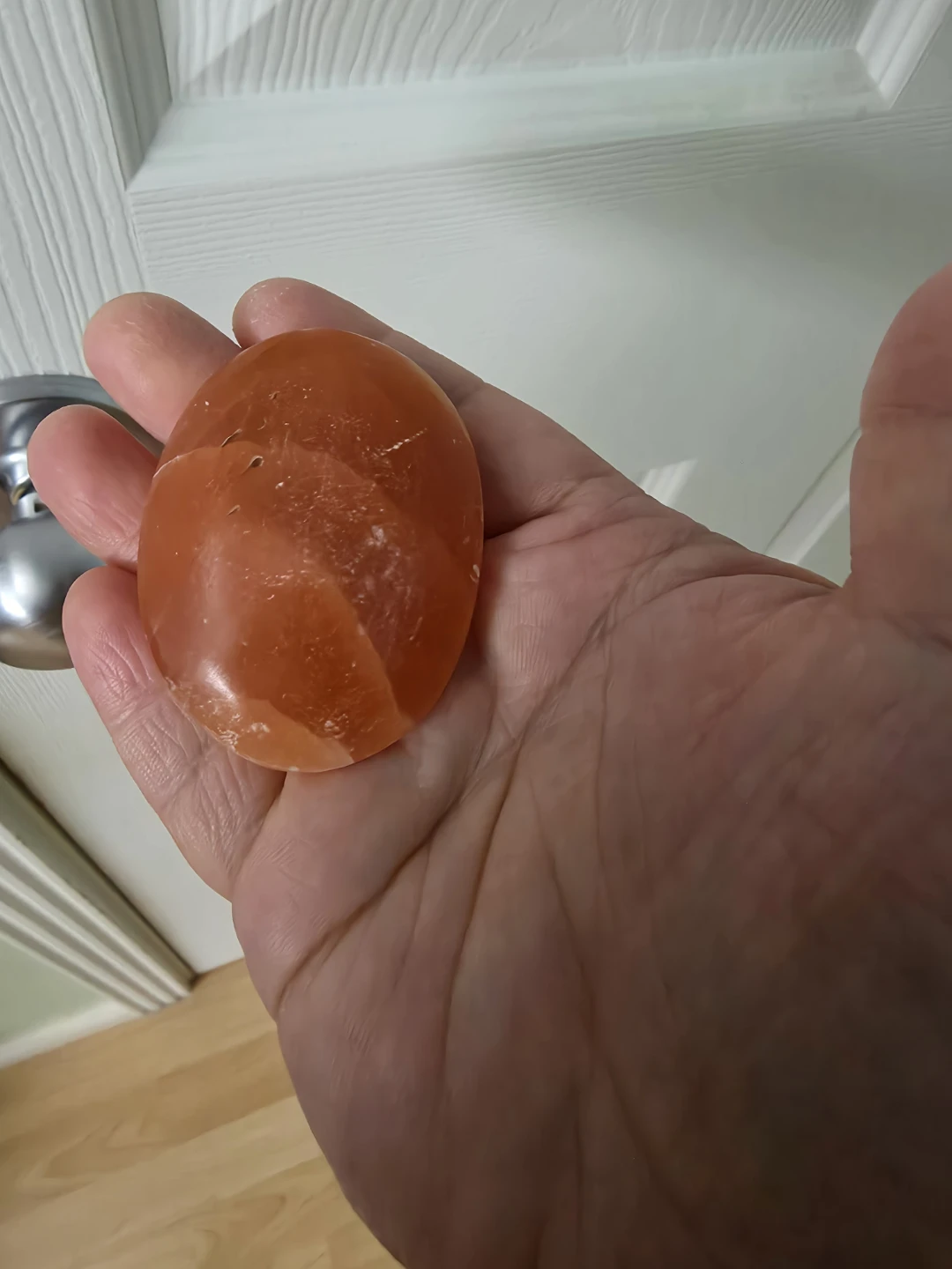 Polished Orange Calcite Palm Stone