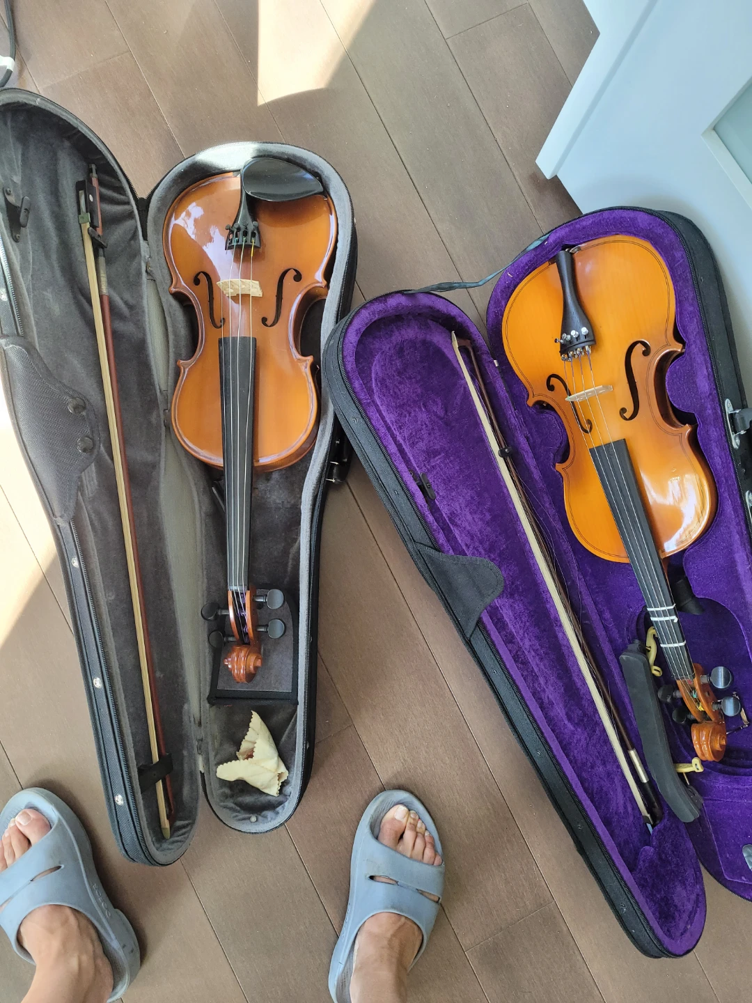 Two violins with cases