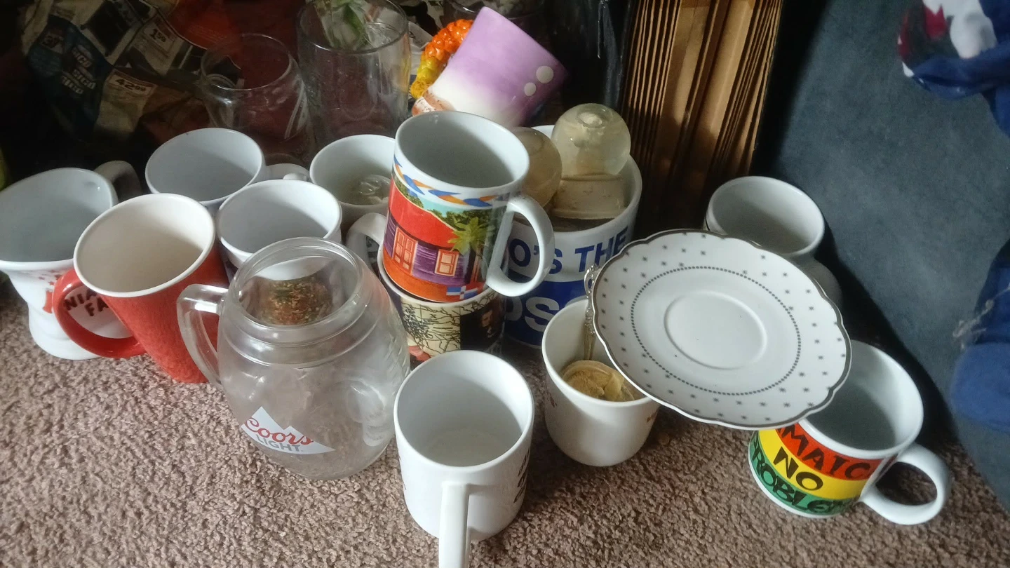 Assorted collection of assorted coffee mugs