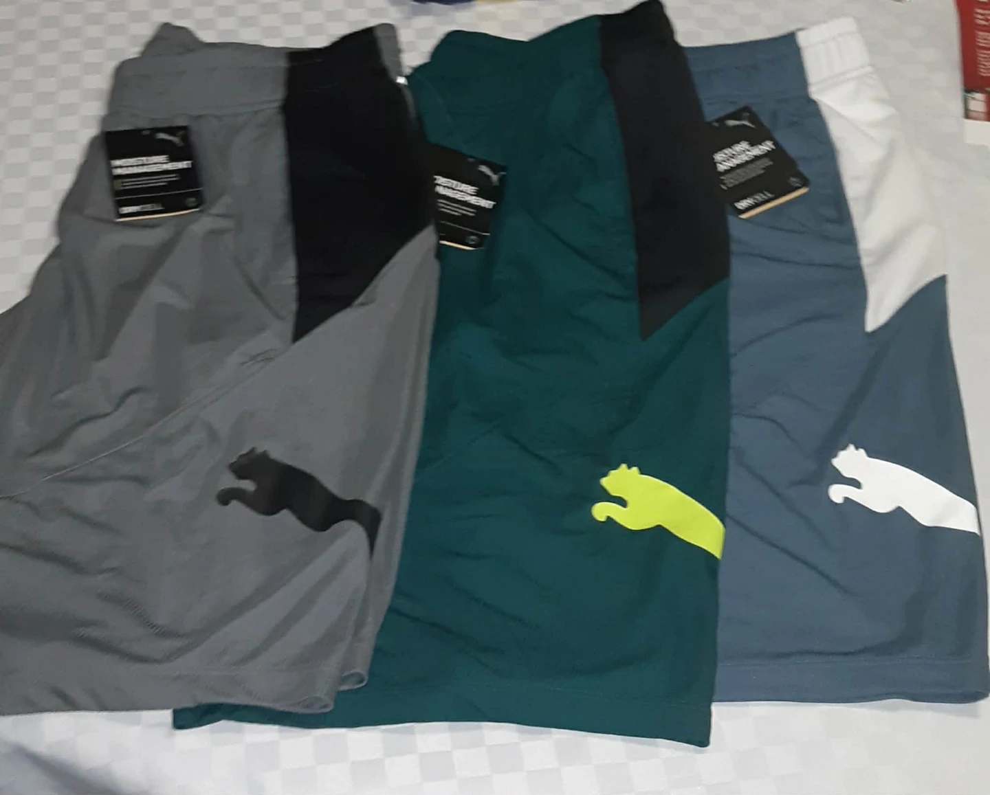 Three pairs of Puma DryCELL shorts