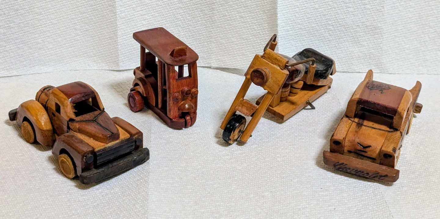 Set of 4 handcrafted wooden vehicle figurines