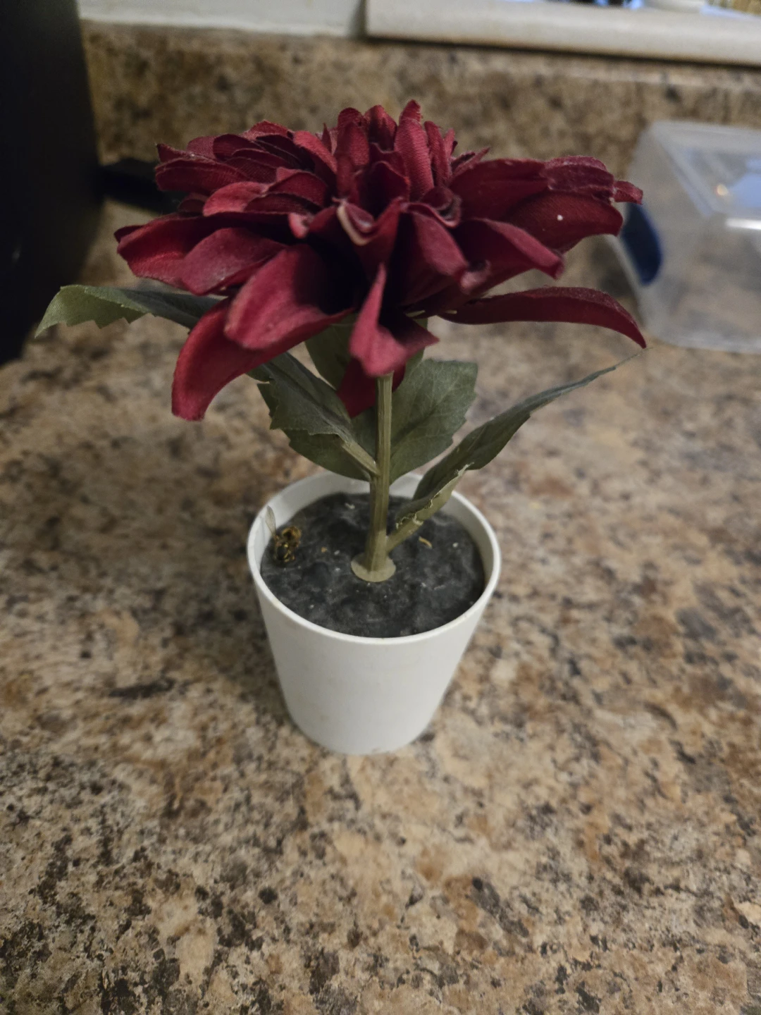 Artificial Red Flower in White Pot