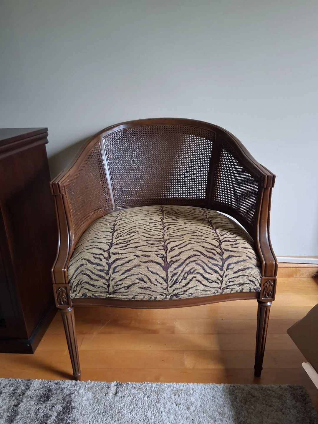 Vintage cane back chair with tiger print seat