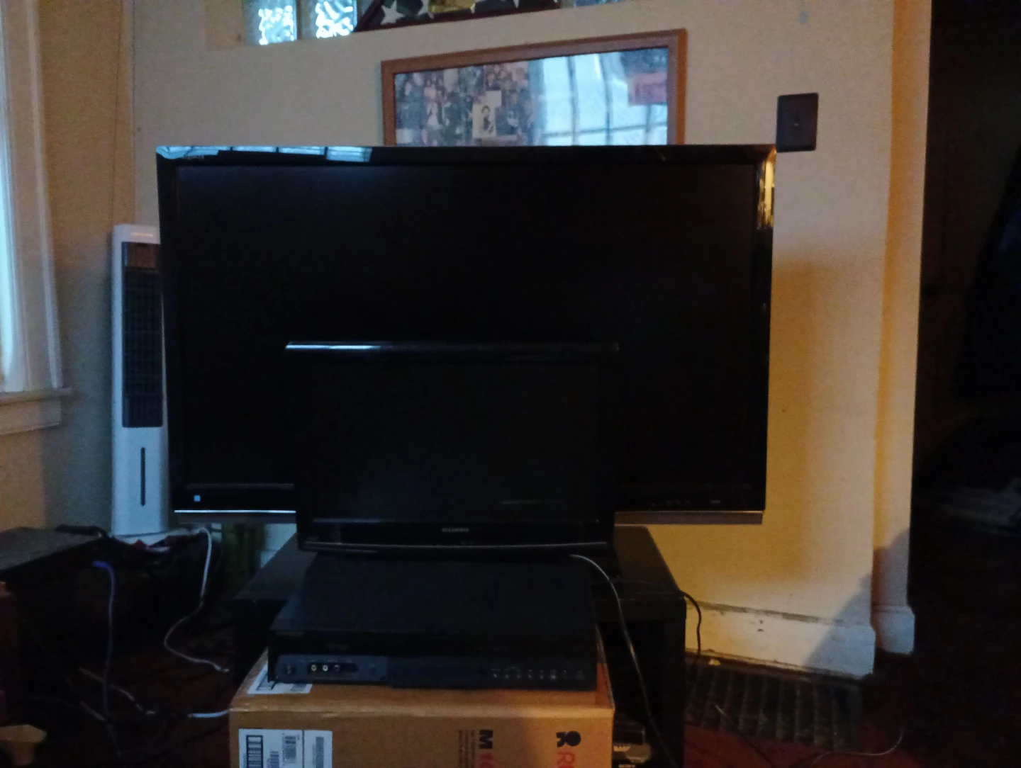 Sharp Aquos 60-inch LCD t.v. and Samsung dvd/VHS player