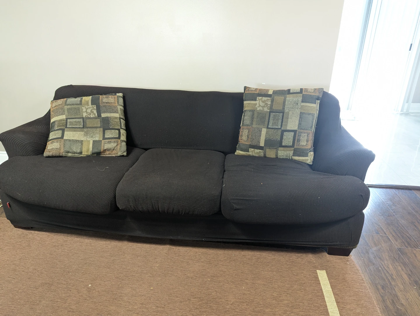 Dark brown three-seater sofa with accent pillows - photo 2