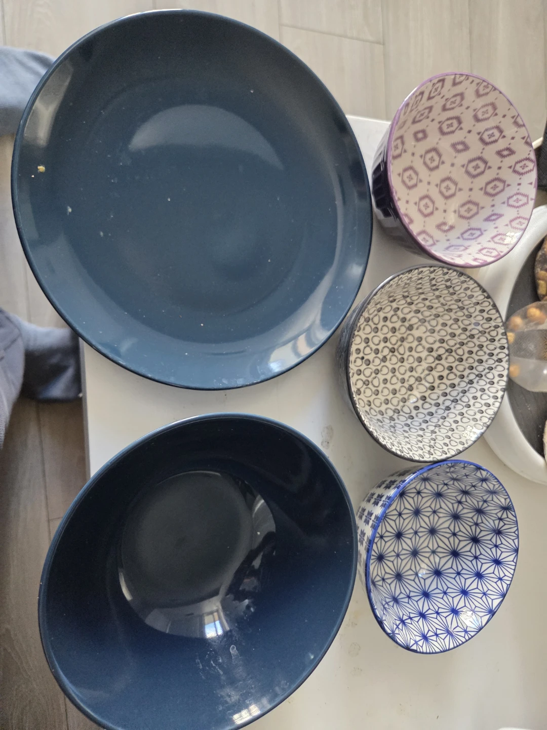 Set of assorted ceramic bowls and plate