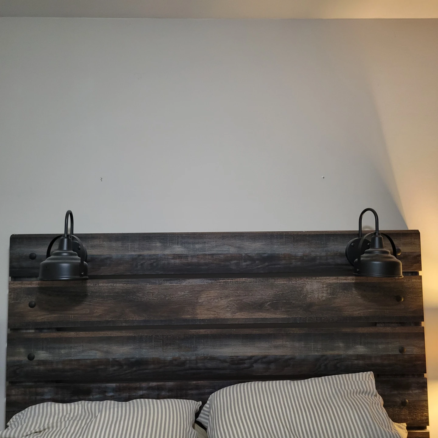 Rustic Wood Headboard with Wall Sconces